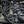 Load image into Gallery viewer, J&amp;L 16-22 Nissan Titan 5.6L Passenger Side Oil Separator 3.0 - Black Anodized
